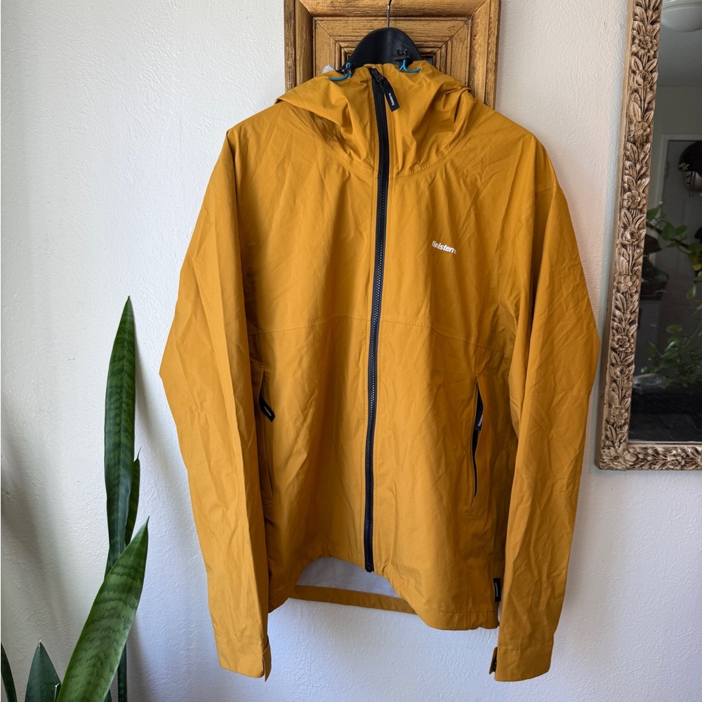 Waterproof Rainbird rain jacket by Finisterre in Sun Glow